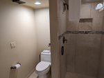 Loft bathroom shower and toilet area. 